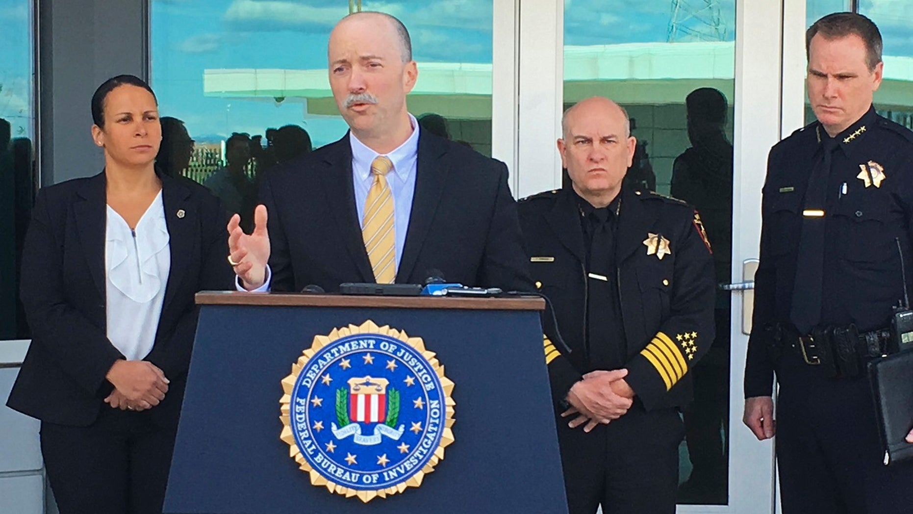 Sean Ragan, FBI special agent in charge, briefs reporters about a crash at the main gate of Travis Air Force Base, Calif., March 23, 2018.