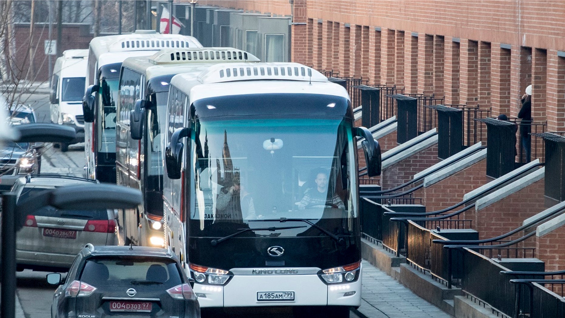 Buses believed to be carrying expelled diplomats prepare to leave the U.S. Embassy in Moscow, Russia, Thursday, April 5, 2018.