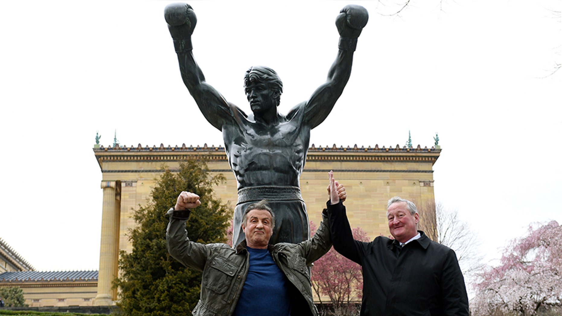 Sylvester Stallone, left, poses with Philadelphia Mayor Jim Kenney in front of the Rocky statue at the Philadelphia Art Museum on Friday.