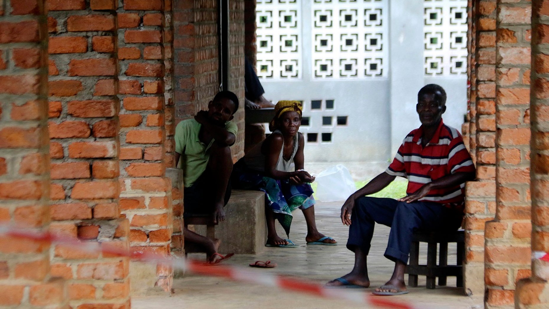 People suspected of having the Ebola Virus wait at a treatment center in Bikoro Democratic Republic of Congo, Sunday, May 13, 2018.