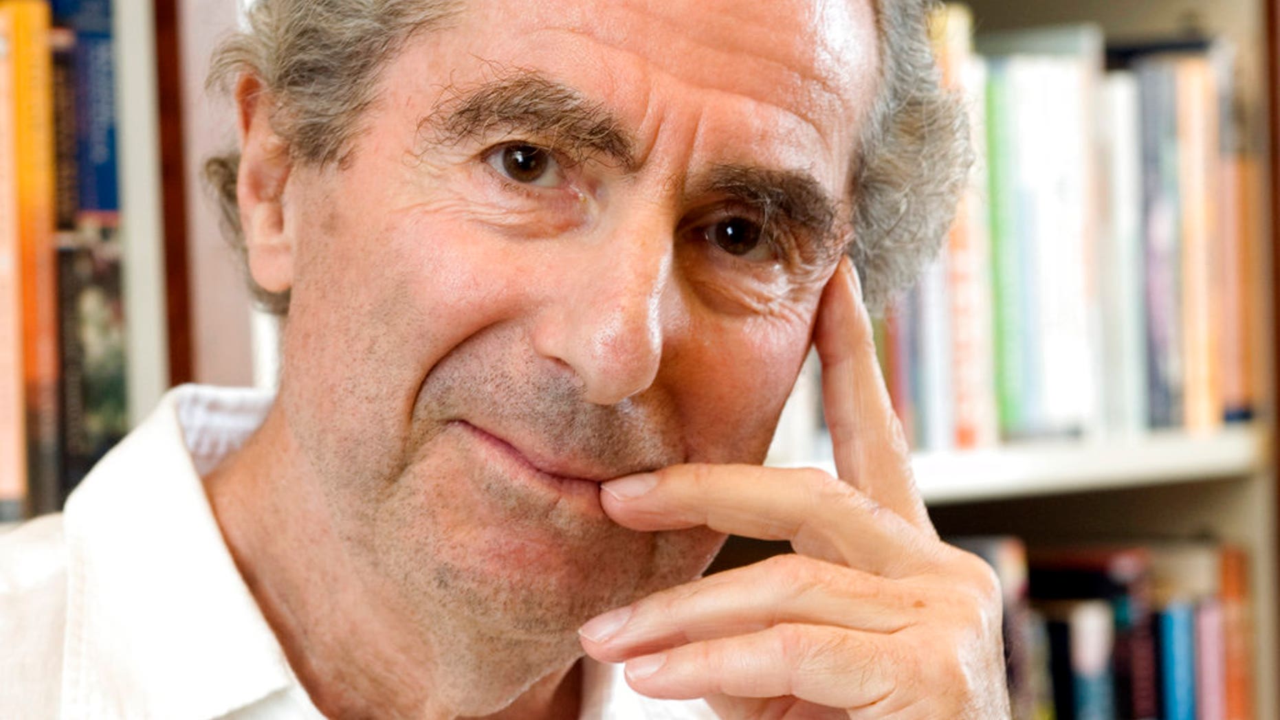 In this Sept. 8, 2008, file photo, author Philip Roth poses for a photo in the offices of his publisher, Houghton Mifflin, in New York.