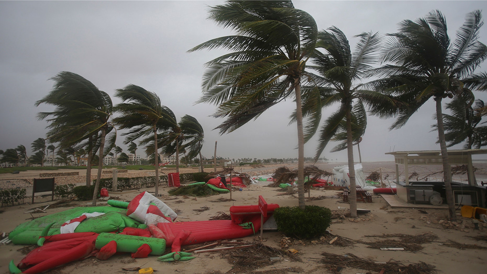 Debris litter a beach after Cyclone Mekunu in Salalah, Oman, Saturday, May 26, 2018. Cyclone Mekunu blew into the Arabian Peninsula early Saturday, drenching arid Oman and Yemen with rain, cutting off power lines, officials said. (AP Photo/Kamran Jebreili)