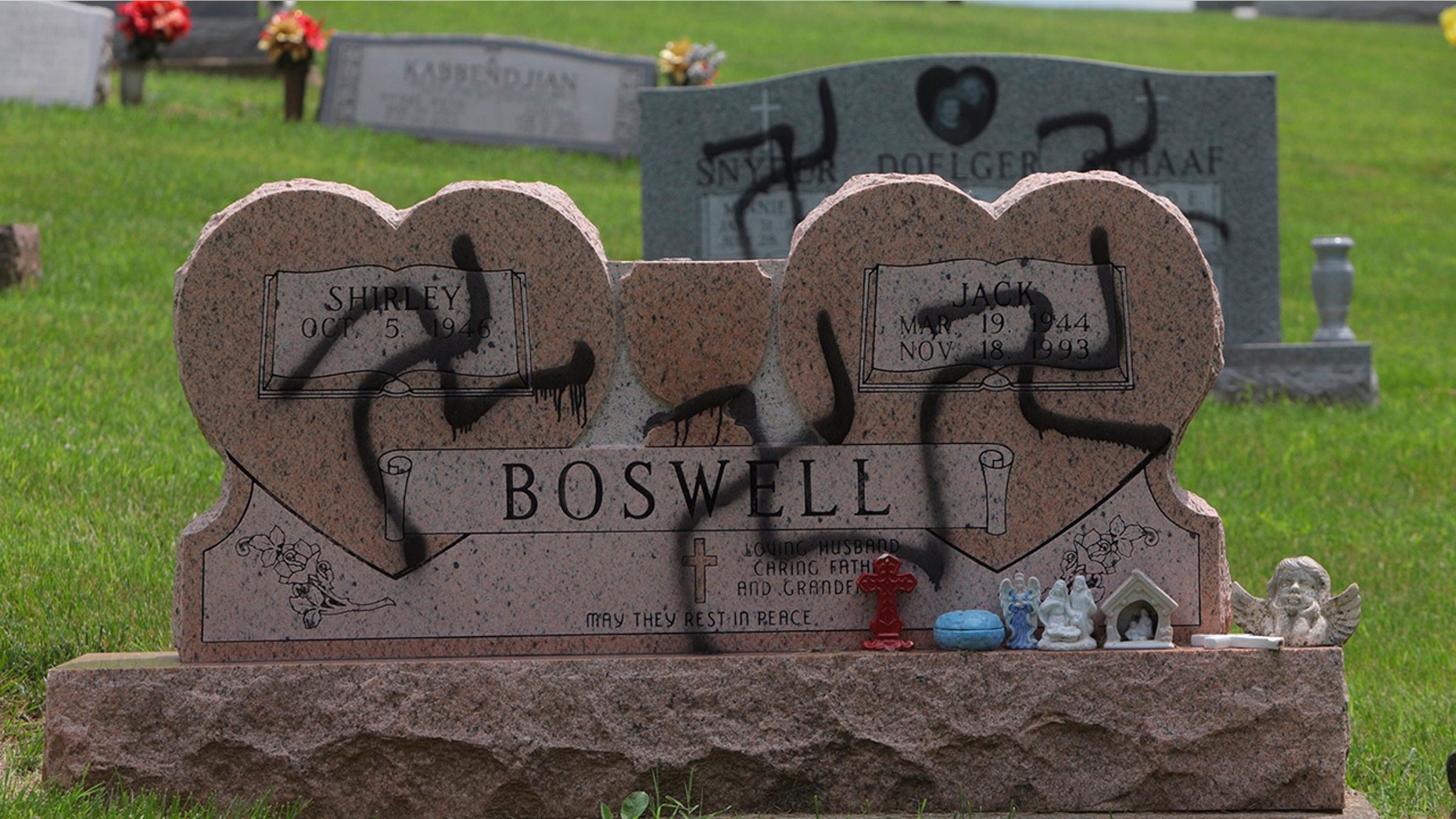 May 26, 2018: Grave markers with swastikas spray-painted on them stand in the Sunset Hill Cemetery in in Glen Carbon, Ill.