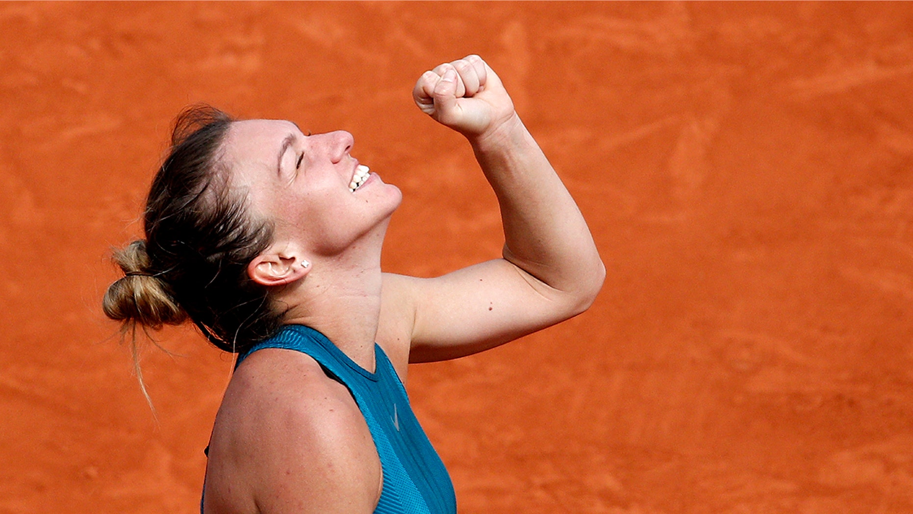 Romania's Simona Halep clenches her fist after defeating Sloane Stephens of the U.S. during their final match of the French Open tennis tournament at the Roland Garros stadium, Saturday, June 9, 2018 in Paris. Halep won 3-6, 6-4, 6-1. (AP Photo/Christophe Ena)