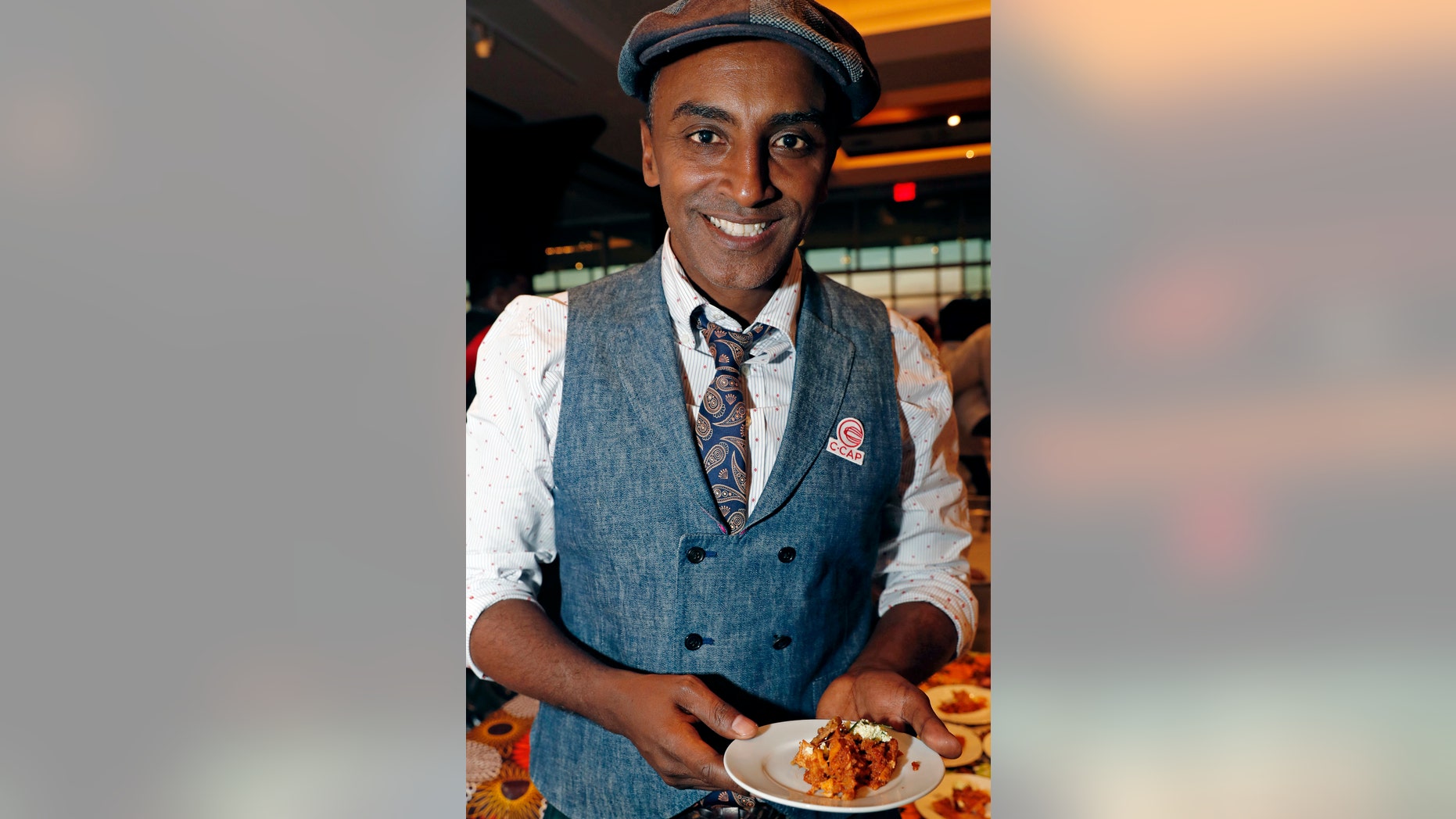 FILE- This Feb. 27, 2018, file photo, shows Chef Marcus Samuelsson in New York. Samuelsson has purchased a former pool hall in the Overtown neighborhood of Miami and plans to open a restaurant there. The redevelopment board is pouring tens of millions into restoring the historic neighborhood to its former glory. (AP Photo/Kathy Willens, File)