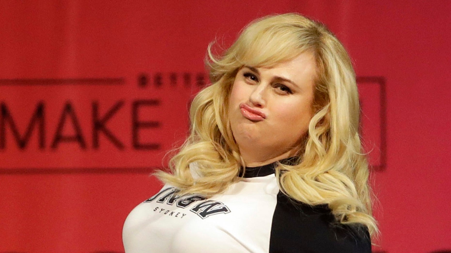 Actress Rebel Wilson struts across the stage as she is introduced to speak at College Signing Day, an event honoring Philadelphia students for their pursuit of a college education or career in the military at Temple University in Philadelphia, May 2, 2018.