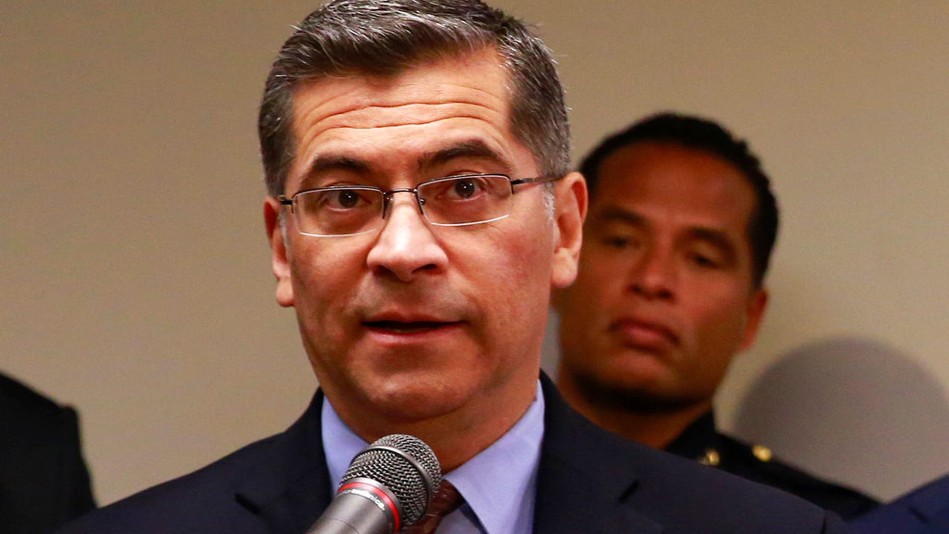 In this March 27, 2018 file photo, California Attorney General Xavier Becerra addresses reporters at a news conference in Sacramento. Becerra on Friday praised the reinstatement of California's right-to-die law.