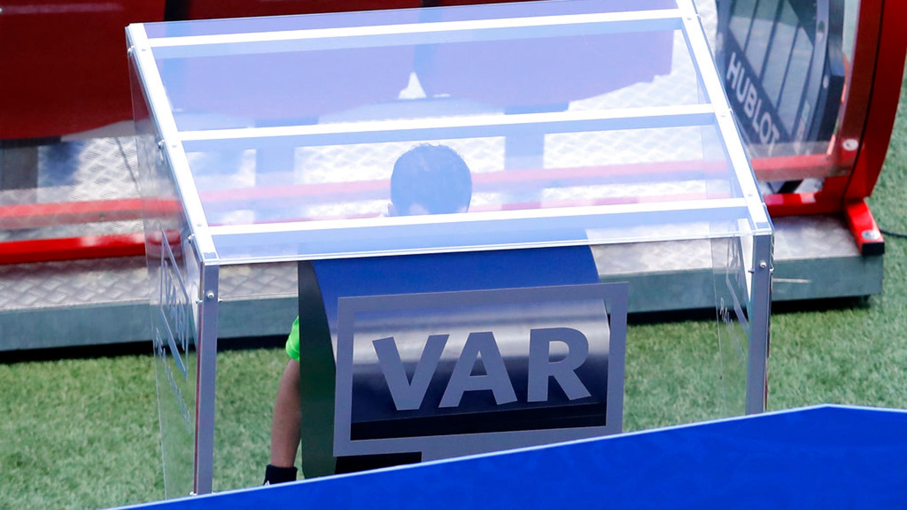 Referee Andres Cunha from Uruguay, center, watches a replay on a screen during the Group C match between France and Australia at the 2018 World Cup in the Kazan Arena in Kazan, Russia