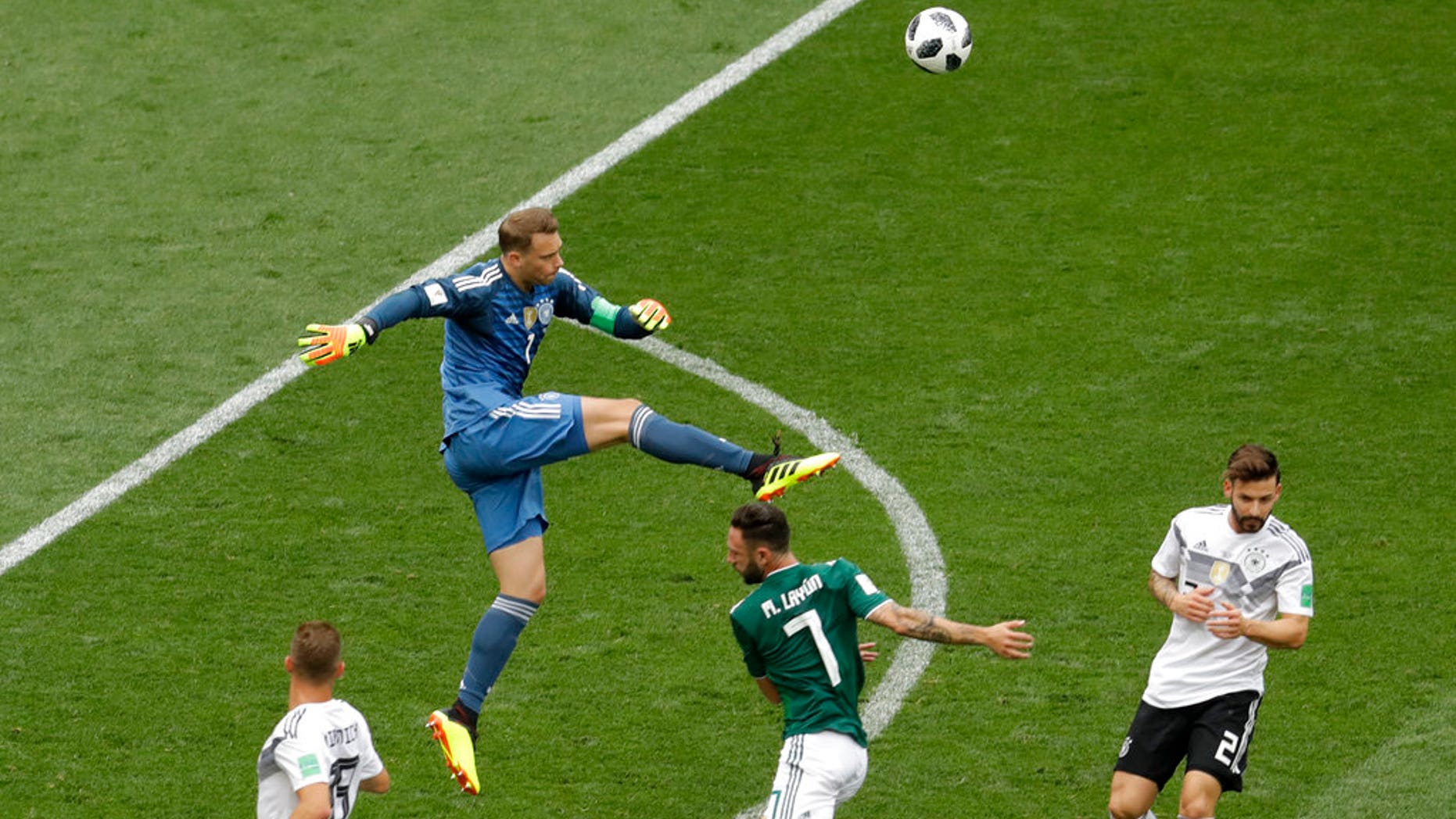Germany goalkeeper Manuel Neuer clears the ball outside of the penalty box during Sunday's Group F match with Mexico.
