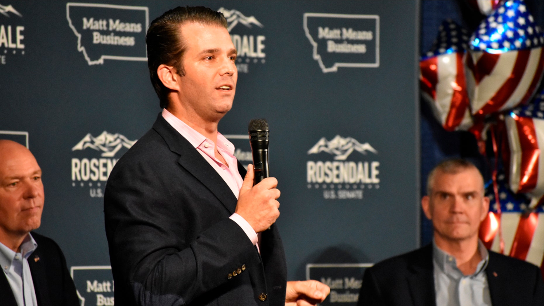 Donald Trump Jr., center, speaks to Montana Republicans at the state party's annual convention as U.S Rep. Greg Gianforte, left, and U.S. Senate candidate Matt Rosendale, right, look on, in Billings, June 22, 2018.