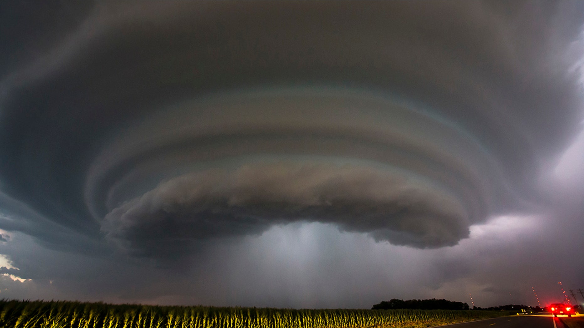 A severe thunderstorm makes its way towards Wichita, Kan., on Tuesday, June, 26, 2018. Multiple storms erupted over south-central Kansas on Tuesday. (Travis Heying/The Wichita Eagle via AP)