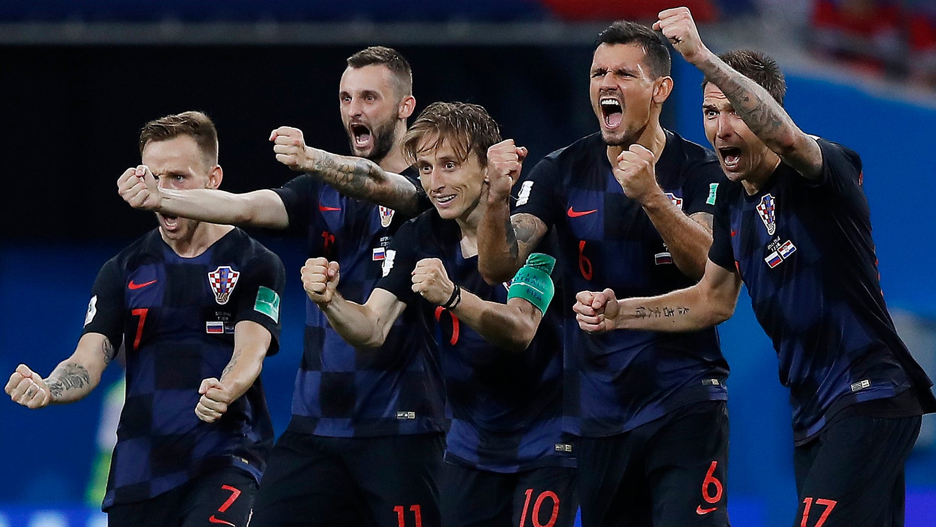 Croatia national soccer team players celebrate after a penalty is saved in a shootout during the quarterfinal match of this year's World Cup tourney. Croatia won the match 4-3.