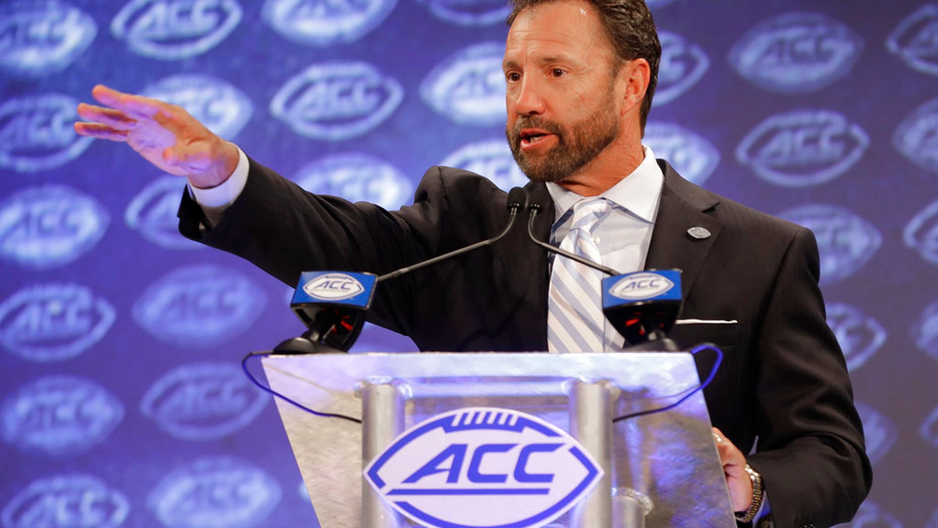 North Carolina head coach Larry Fedora answers a question during a news conference at the NCAA Atlantic Coast Conference college football media day in Charlotte, N.C., Wednesday, July 18, 2018.