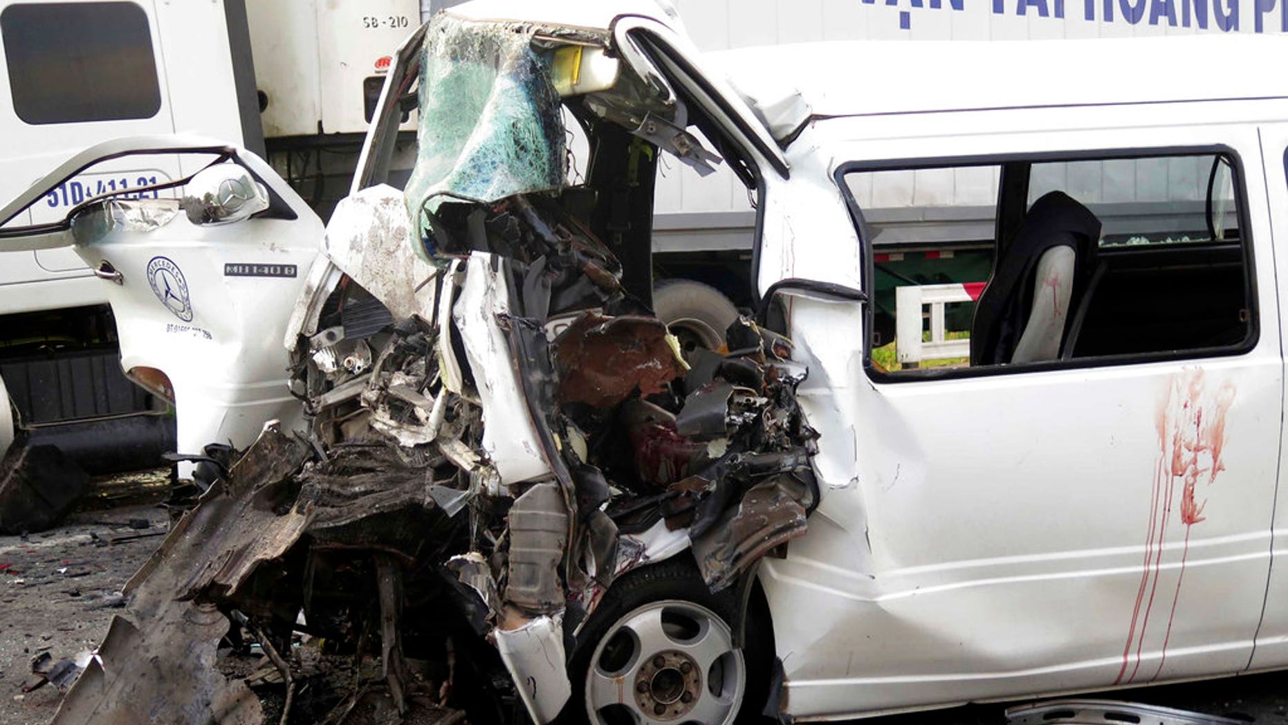 A van, carrying 17 people in a wedding party, collided head-on with an incoming container truck in Vietnam.