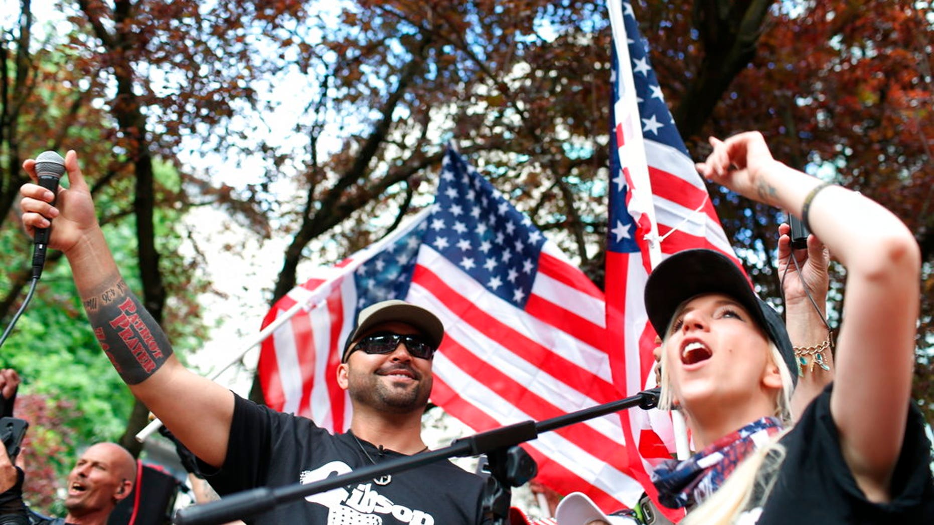 Joey Gibson, left, leader of Patriot Prayer, leads a previous rally in Portland, Oregon on June 30, 2018.