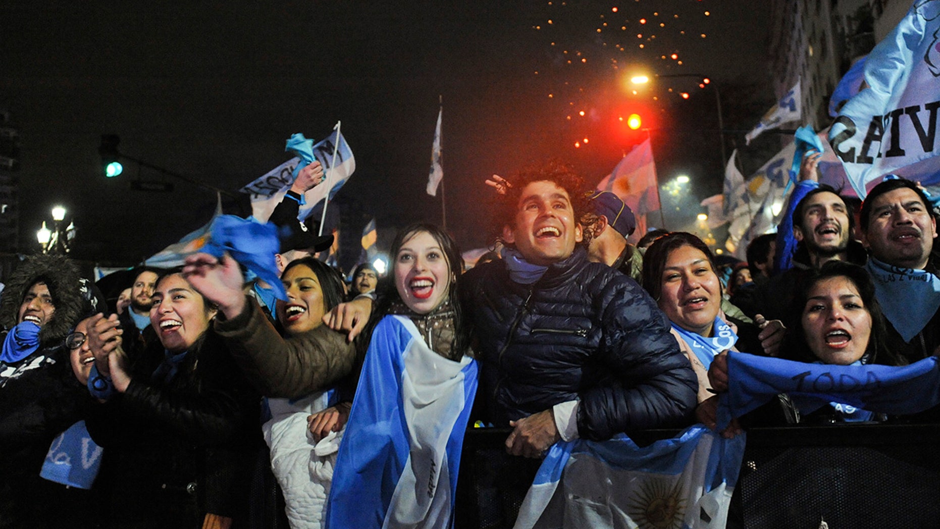 Demonstrators against decriminalizing abortion celebrate outside Congress after the Argentine Senate rejected a bill to legalize elective abortion for pregnancies up to 14 weeks