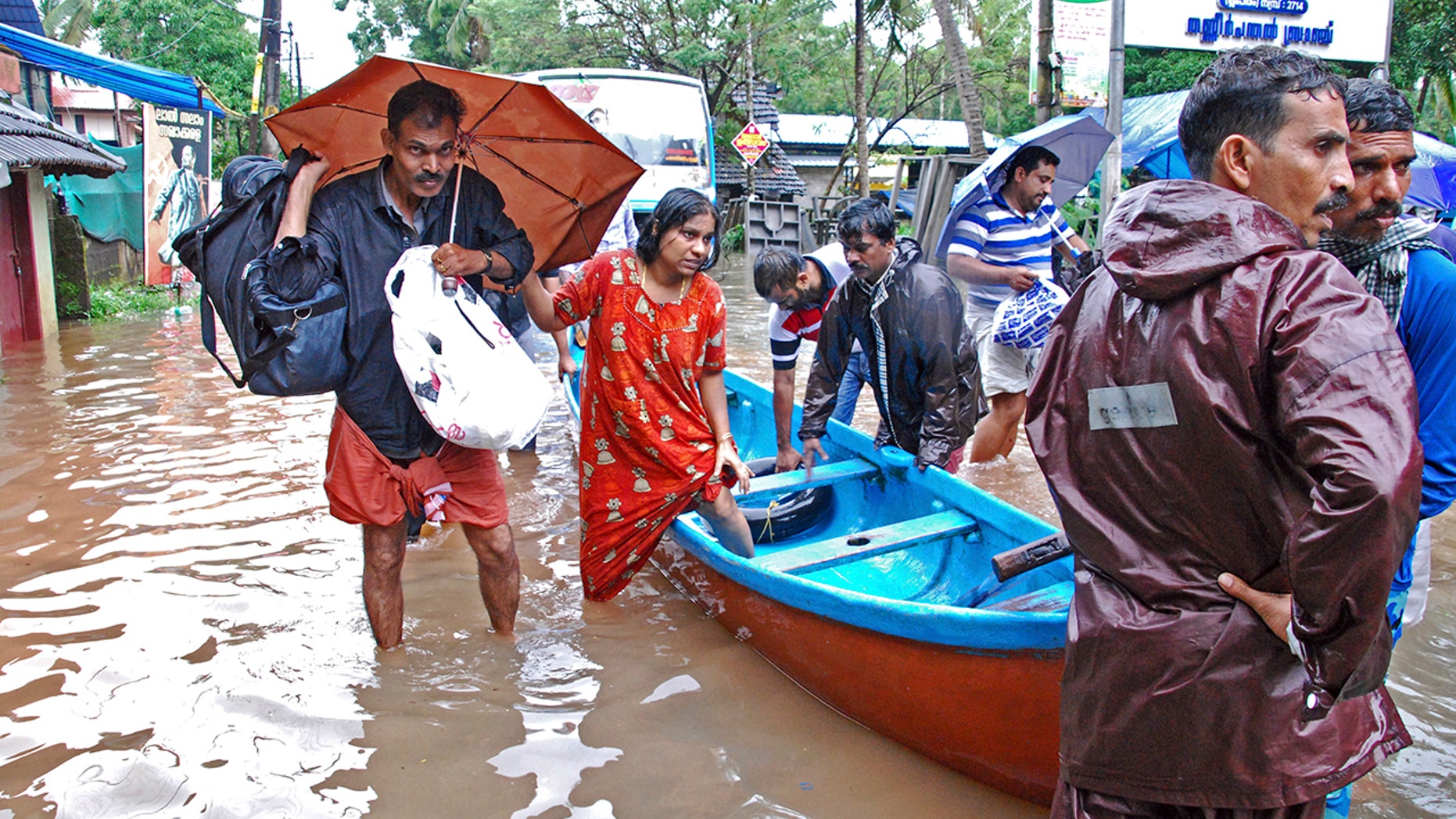 Flood victims are evacuated to safer areas in Kozhikode, in the southern Indian state of Kerala, Thursday, Aug. 16, 2018. Torrential monsoon rains have disrupted air and train services in the southern Indian state of Kerala, where flooding, landslides and bridge collapses have killed dozens of people in the past week, officials said. (AP Photo/K. Shijith)