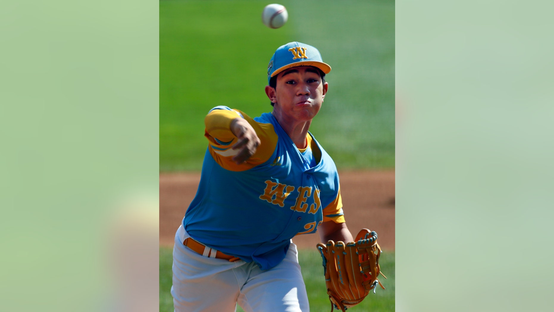 Honolulu, Hawaii's Aukai Kea delivers in the first inning of the United States Championship baseball game against Peachtree City, Georgia at the Little League World Series tournament in South Williamsport, Pa., Saturday, Aug. 25, 2018.
