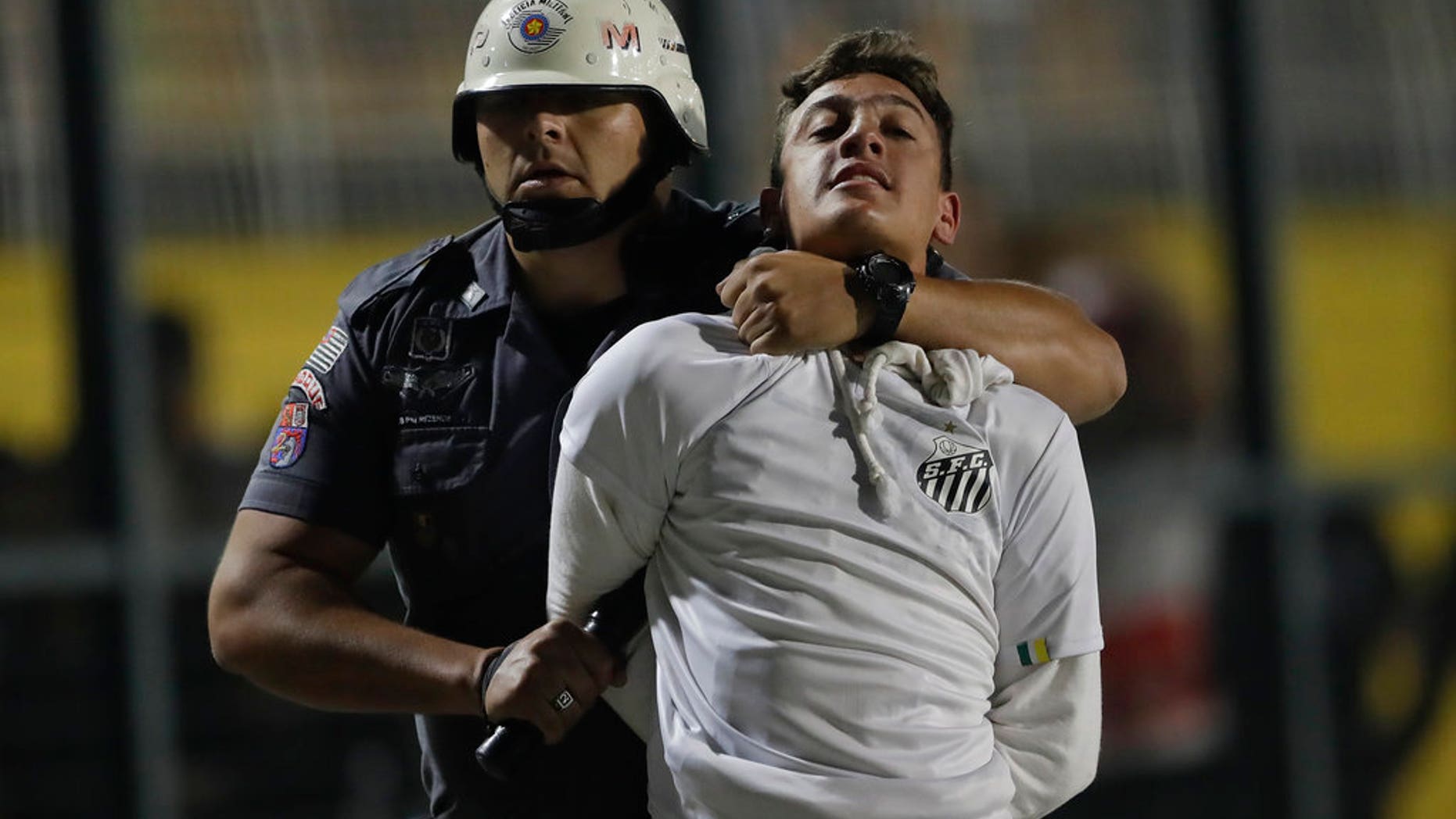 Police clash with soccer fans protesting 3-0 score imposed before match, game abandoned.