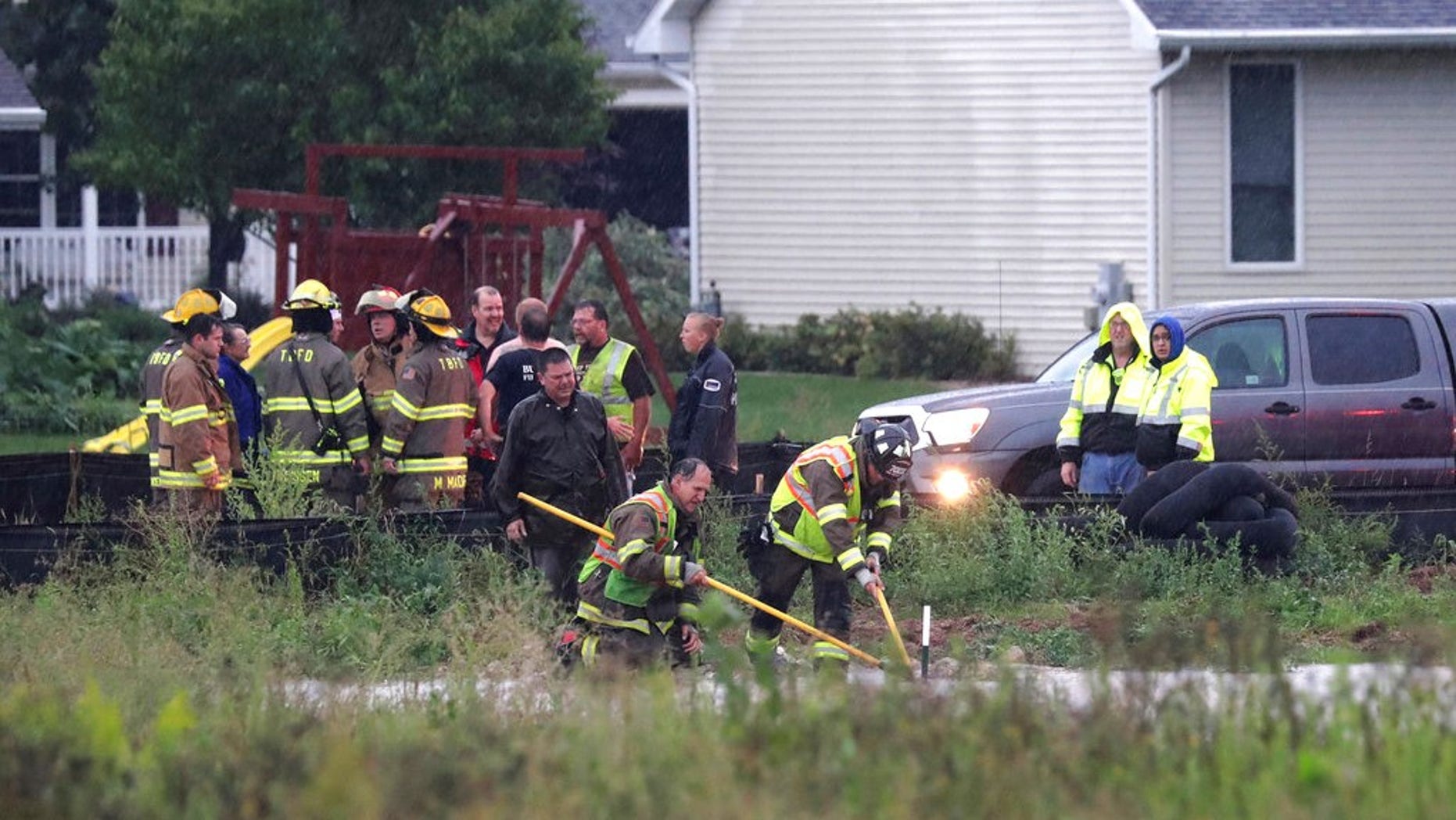 A boy sucked into the flooded Wisconsin storm sewer was saved when an eagle-eyed firefighter saw the boy's fingers pop through an opening in a manhole cover.