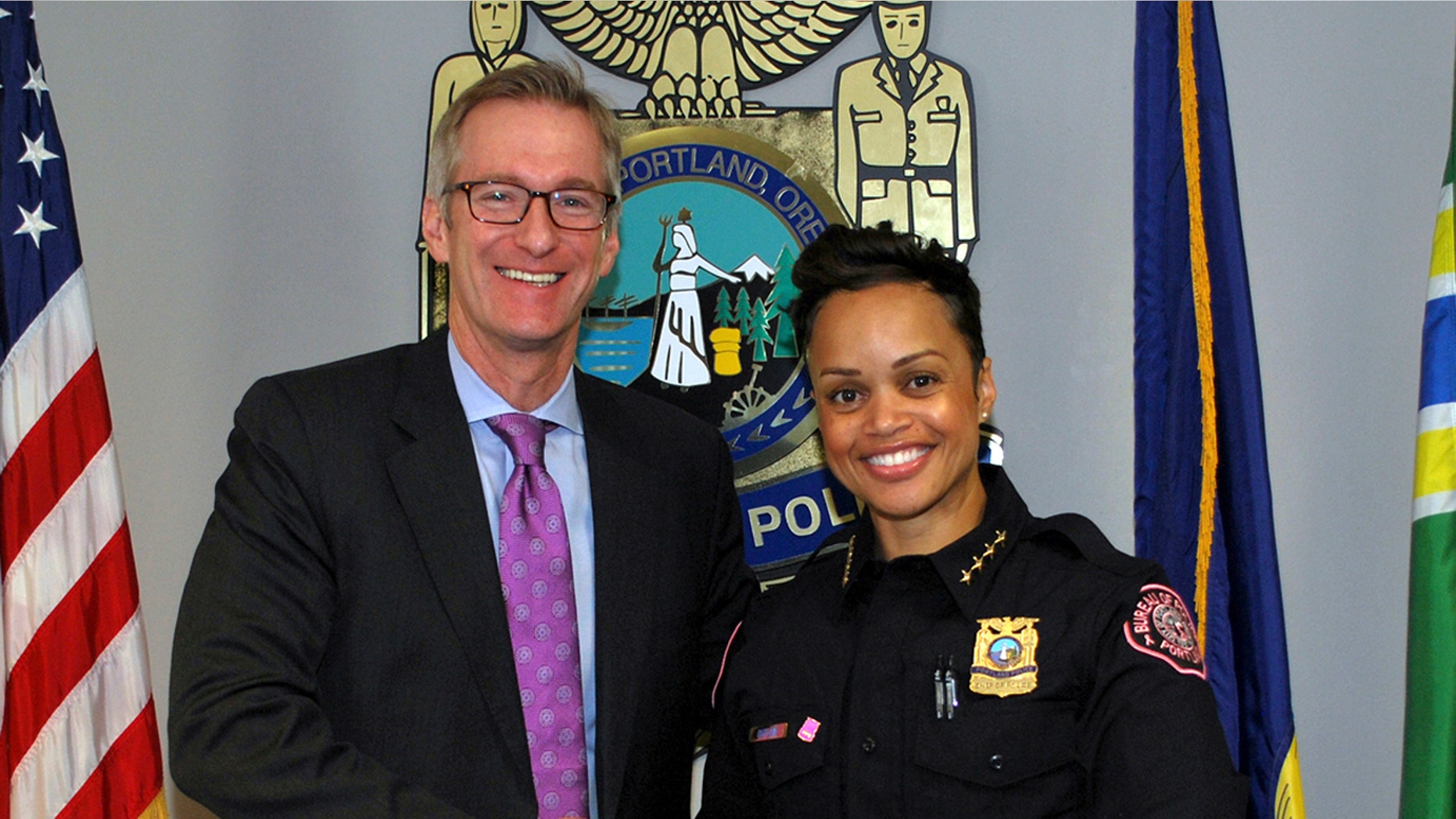 Portland Mayor Ted Wheeler and Chief Danielle Outlaw of the Portland Police Bureau are seen Oct. 2, 2017.