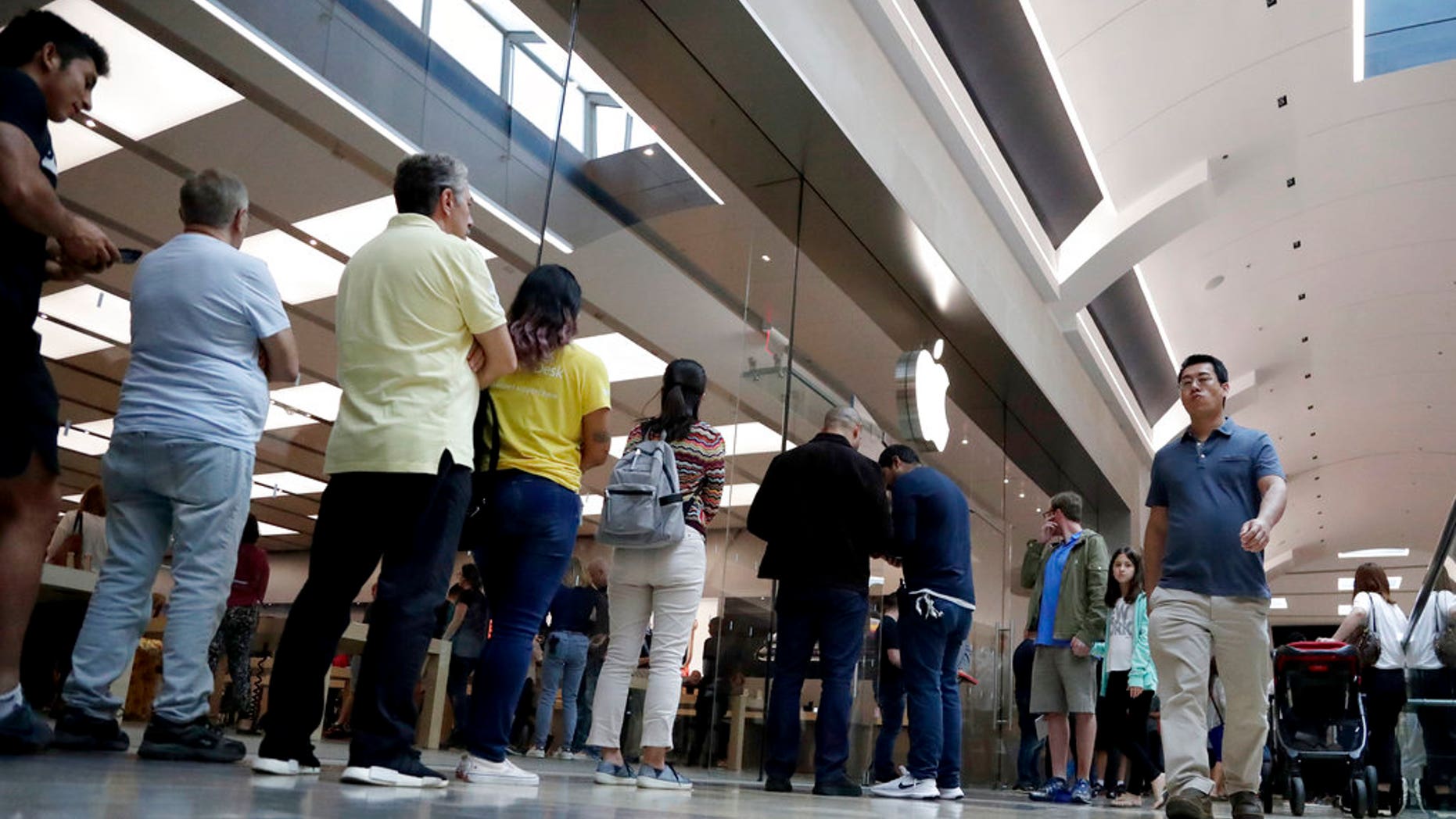 customers wait in line outside of the apple store at the garden state plaza on the - Apple Store Garden State Plaza customers wait in line outside of the apple store at the garden state plaza on the - Apple Store Garden State Plaza
