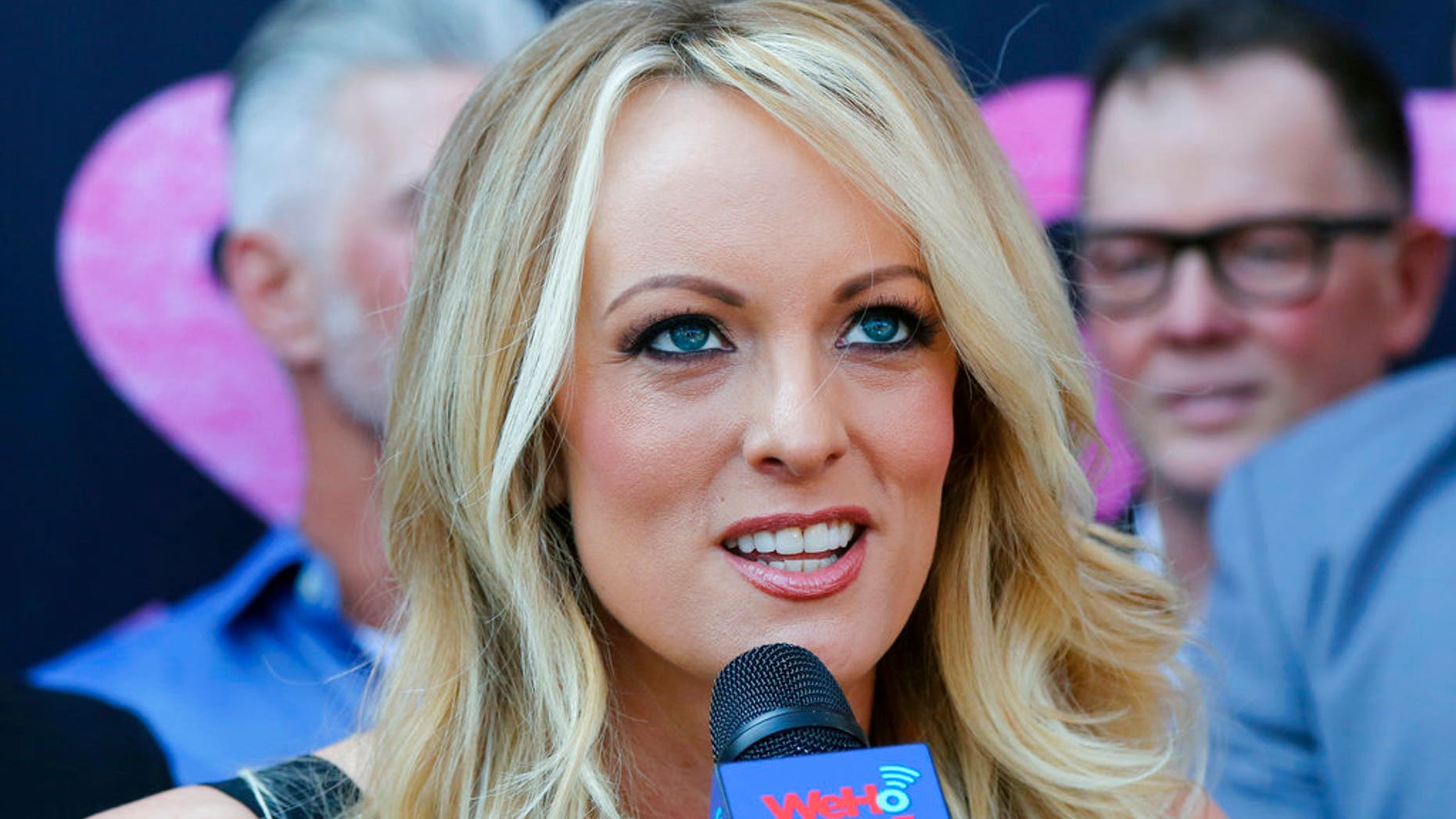 FILE: Adult film actress Stormy Daniels, speaks during a ceremony for her receiving a City Proclamation and Key to the City in West Hollywood, Calif.