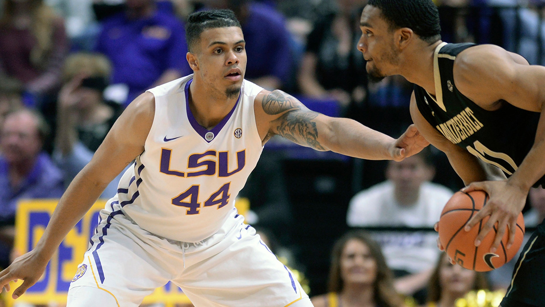 FILE - In this Feb. 20, 2018, file photo, LSU forward Wayde Sims (44) defends against Vanderbilt forward Jeff Roberson (11) during an NCAA college basketball game, in Baton Rouge, La. LSU basketball player Wayde Sims has died after he was shot near the campus of another school in Baton Rouge. Police say in a news release that the 20-year-old Sims was shot around 12:30 a.m. Friday, Sept. 28, 2018, near the campus of Southern University. Sgt. Don Coppola Jr. said Sims was taken to a hospital with an apparent gunshot wound and died. (Hilary Scheinuk/The Advocate via AP, File)