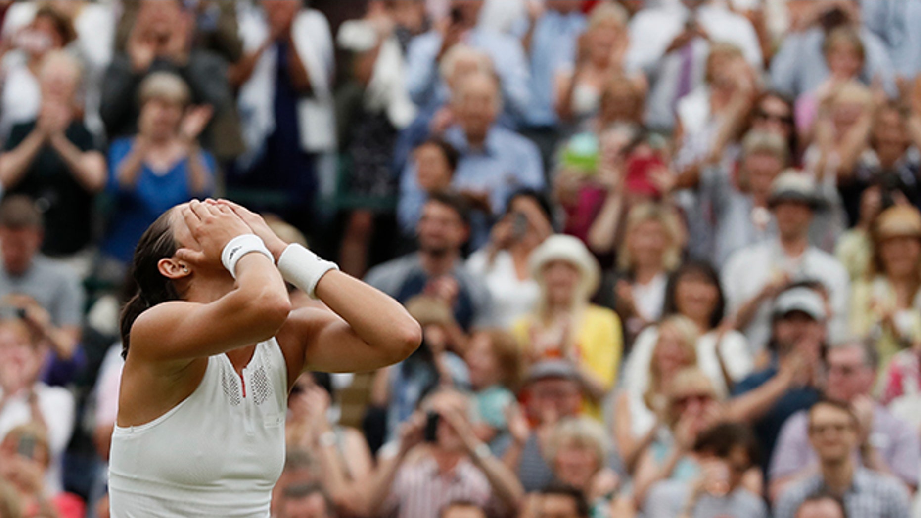 Spain's Garbine Muguruza celebrates after beating Venus Williams of the United States to win the Women's Singles final match on day twelve at the Wimbledon Tennis Championships in London Saturday, July 15, 2017.