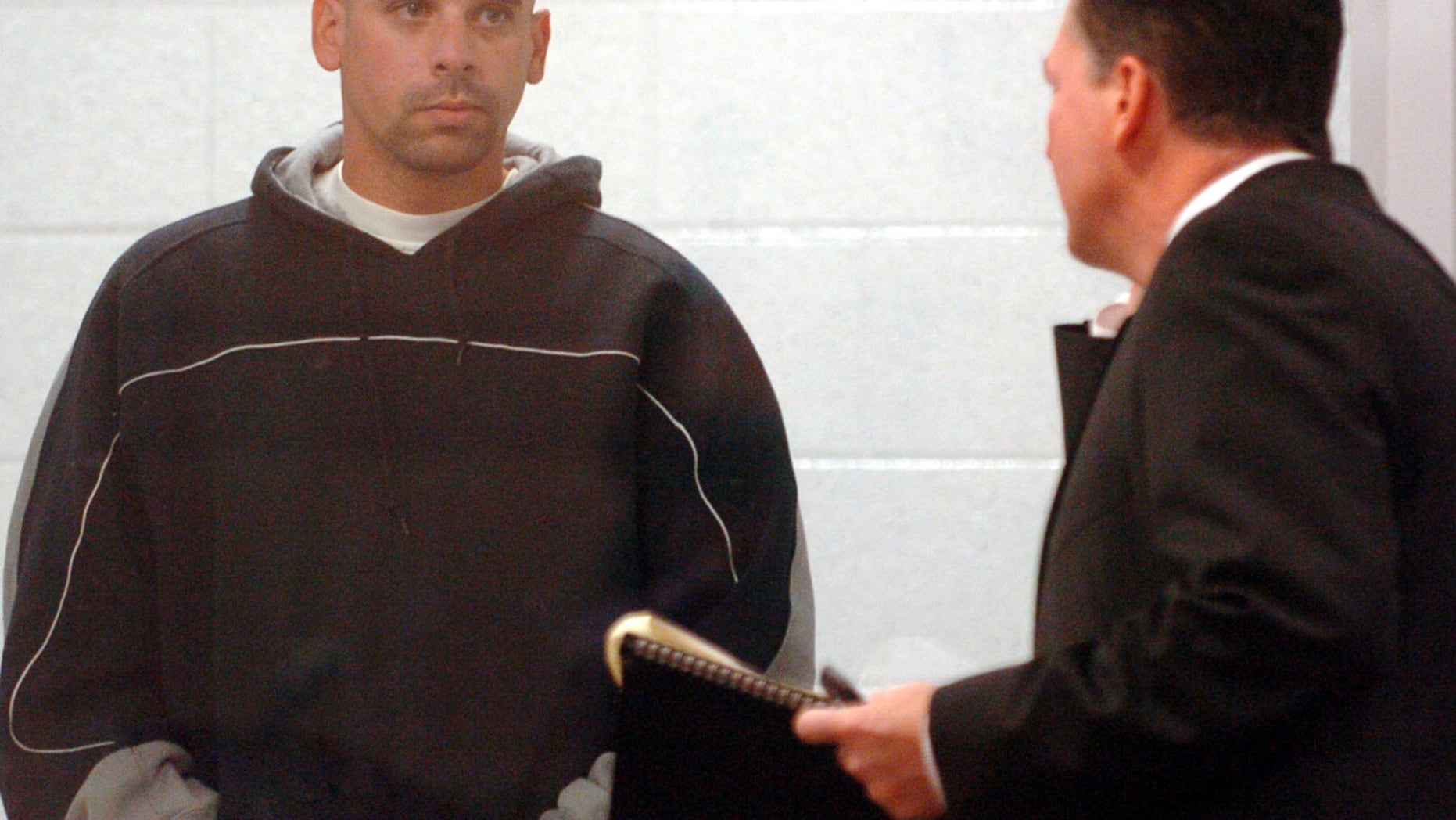 Raymond Lee Jennings, left, with public defender John Henderson in 2005.