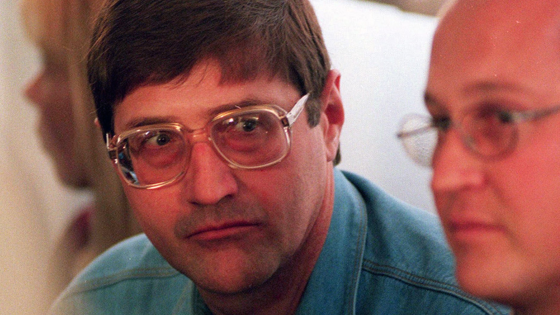 Eugene de Kock, the head of a covert police unit that tortured and killed dozens of people, attends an amnesty hearing of the Truth and Reconciliation Commission in 1998.