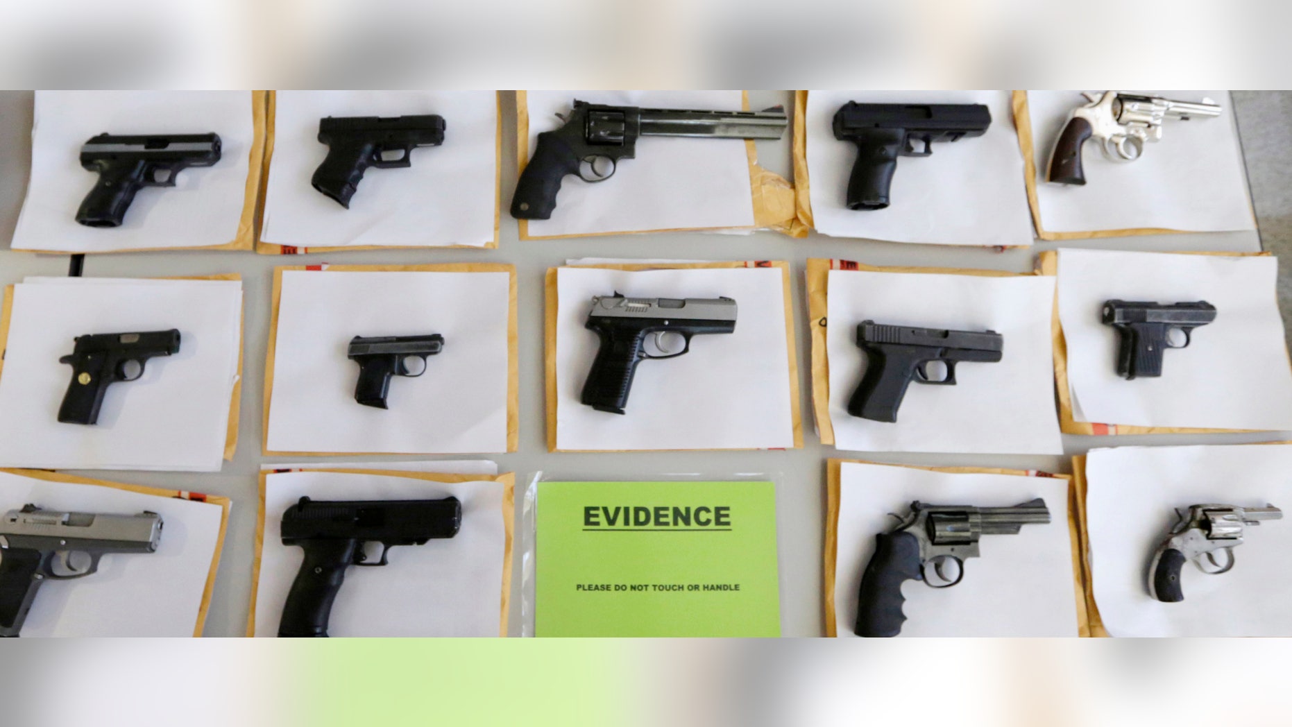 In this July 7, 2014 file photo, Chicago police display some of the thousands of illegal firearms they confiscated during the year in their battle against gun violence in Chicago. At a news conference Tuesday, March 1, 2016, Chicago police said there have been about twice as many homicides and shootings so far this year in Chicago as compared to the same period in 2015.