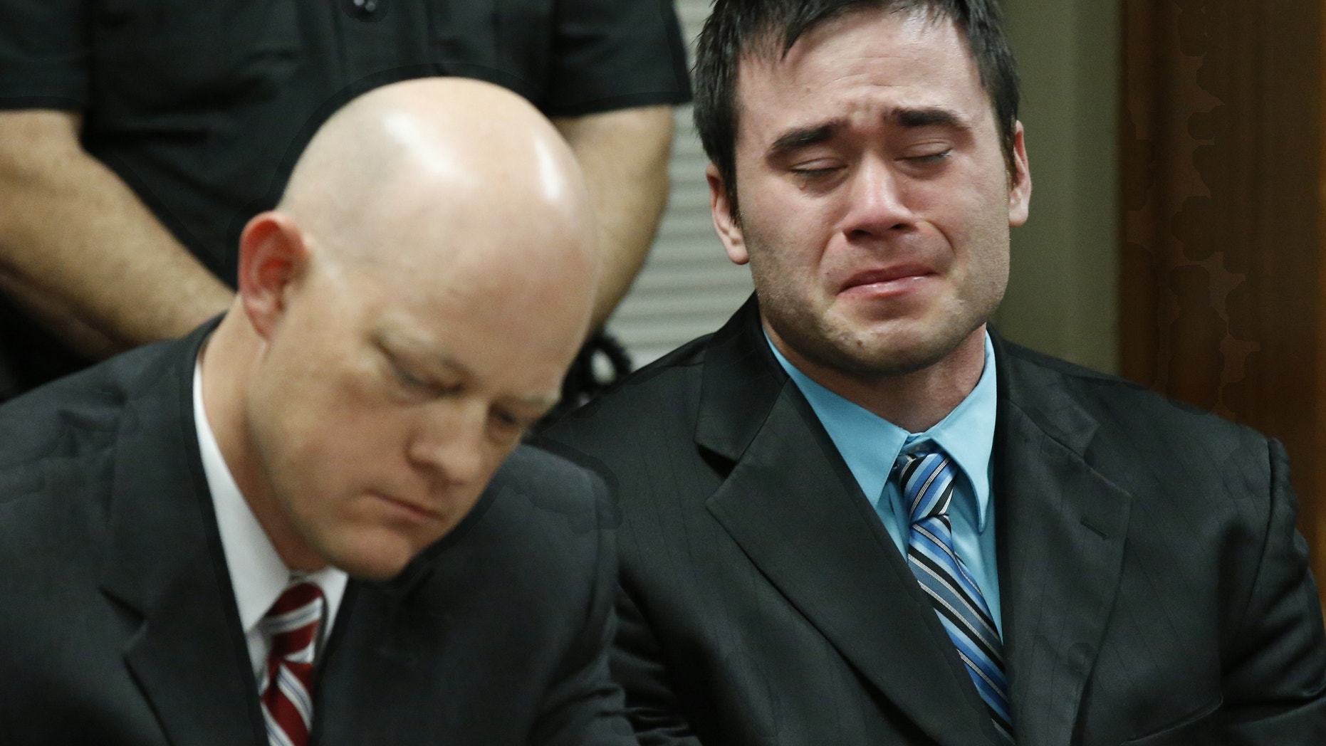 Dec. 10, 2015: Daniel Holtzclaw, right, cries as the verdicts are read in his trial in Oklahoma City.