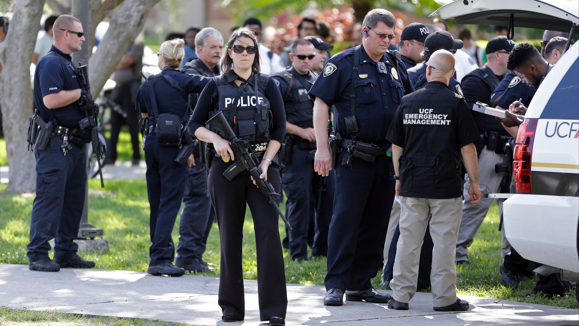Armed officers outside the University of Central Florida campus library after reports of a person with a gun emerged.