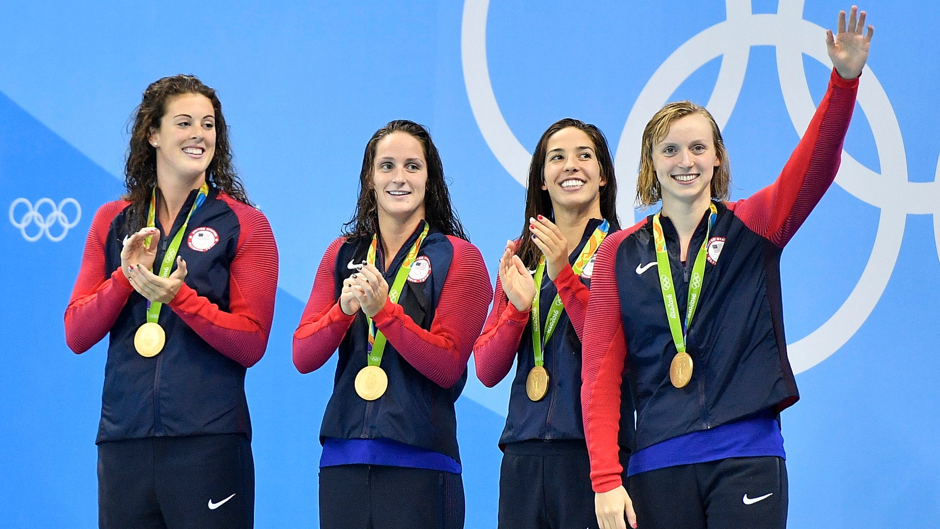 Allison Schmitt, Leah Smith, Maya DiRado and Katie Ledecky, from left, celebrate their gold medals in the women's 4 x 200-meter freestyle relay.