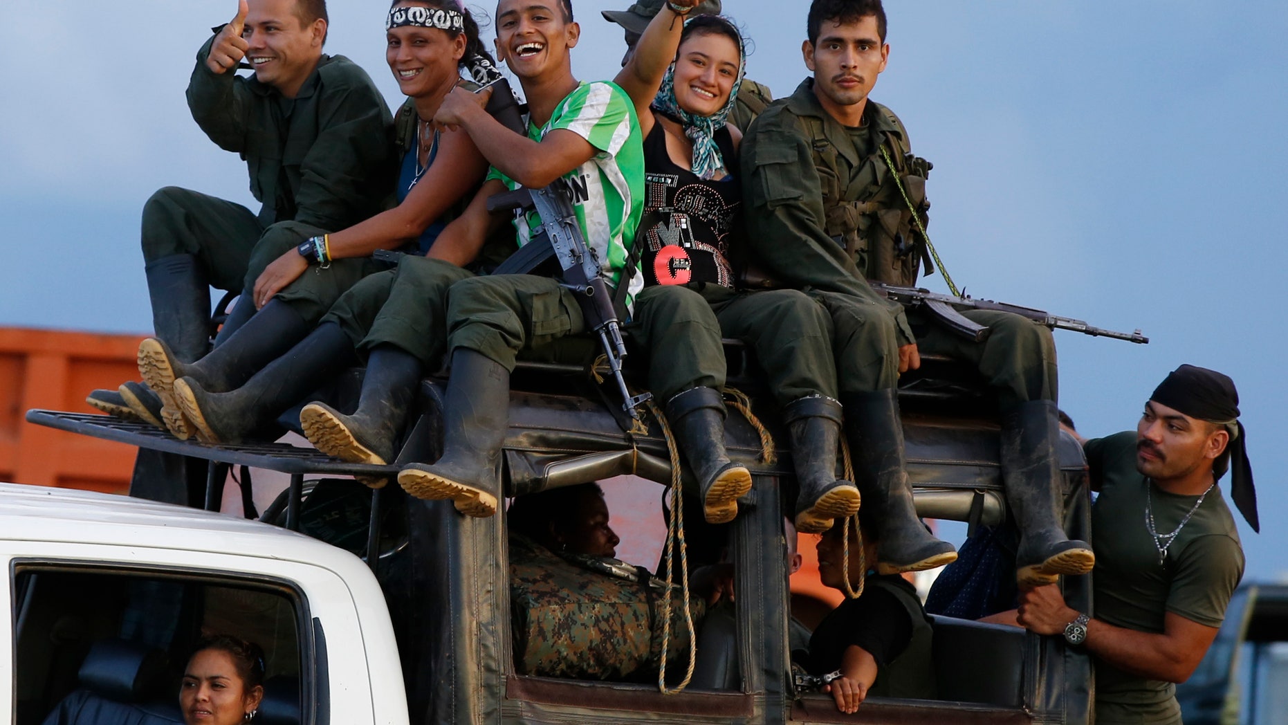 Rebels of the Revolutionary Armed Forces of Colombia (FARC) arrive to El Diamante in southern Colombia, Friday, Sept. 16, 2016. FARC rebels are gathering for a congress to discuss and vote on a peace accord reached with the Colombian government to end five decades of war.