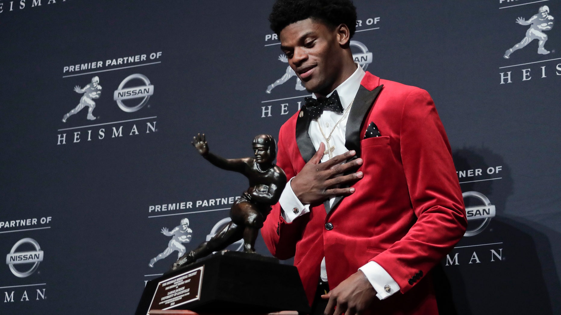 Louisville's Lamar Jackson winning the Heisman Trophy award Saturday.