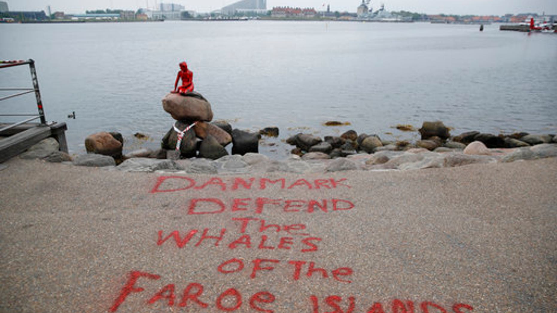 Red paint covering the vandalized Little Mermaid statue in Copenhagen on Tuesday.