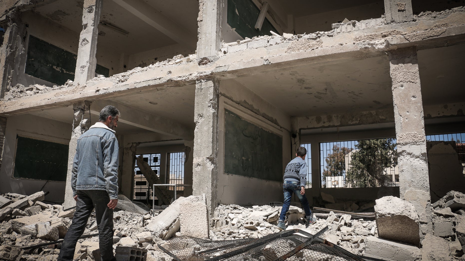 A school destroyed in fighting east of Damascus Monday.