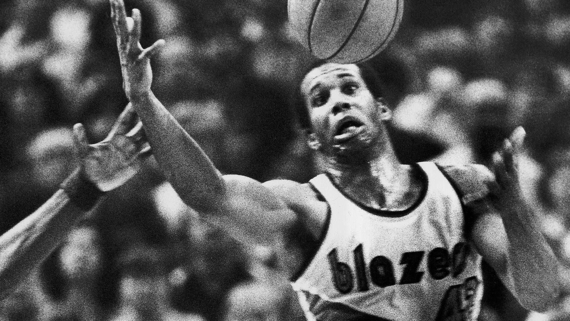 The Portland Trail Blazers' Kermit Washington gaining control of a loose ball in 1979.