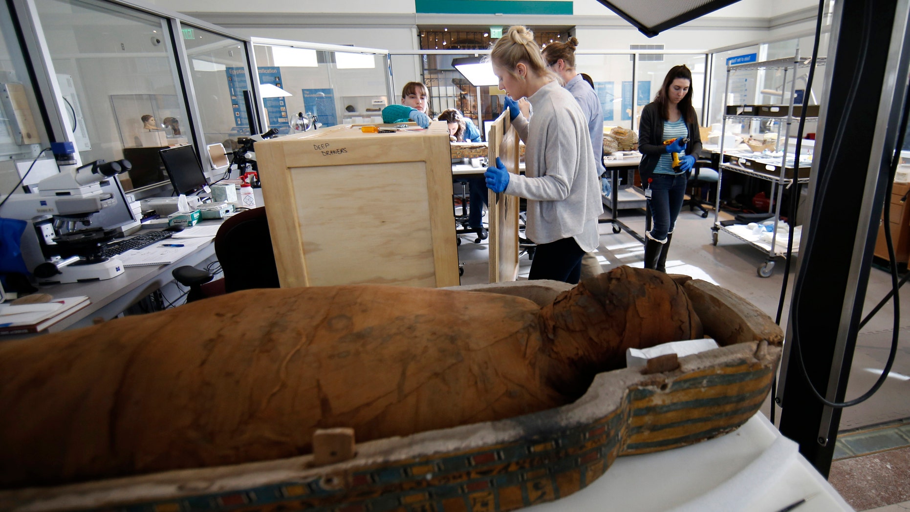 A technician a secure a crate of artifacts at the Penn Museum Thursday.