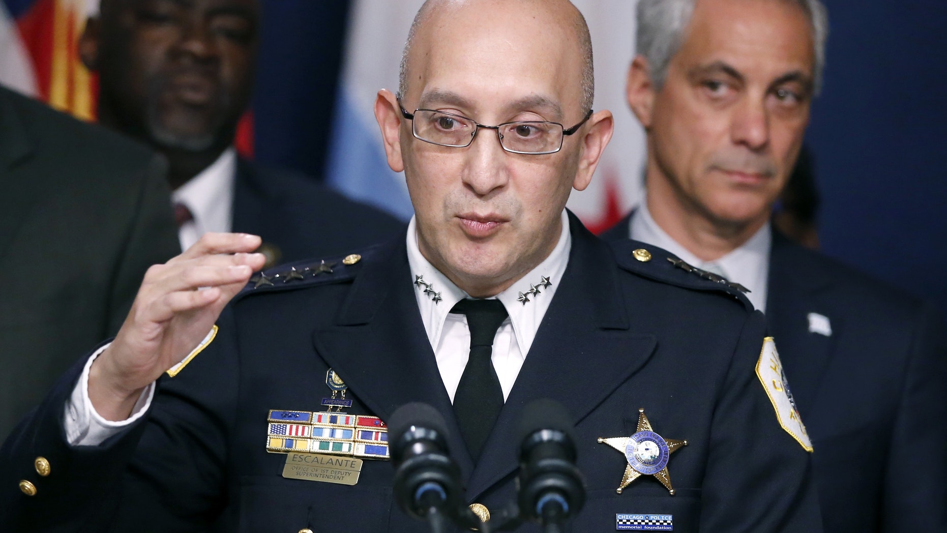 Chicago Police Superintendent John Escalante, left, speaks as Mayor Rahm Emanuel listens in December.