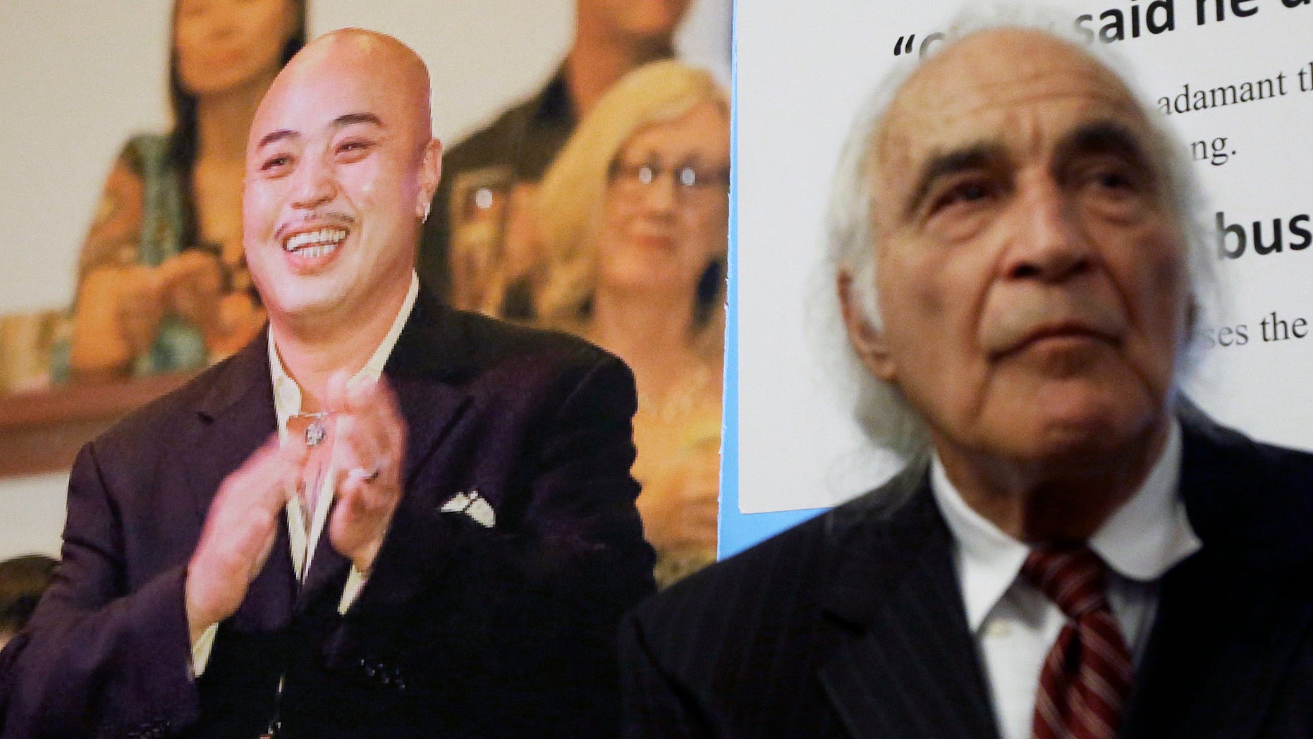 Tony Serra, right, an attorney for Raymond "Shrimp Boy" Chow, pictured at left, in 2014.