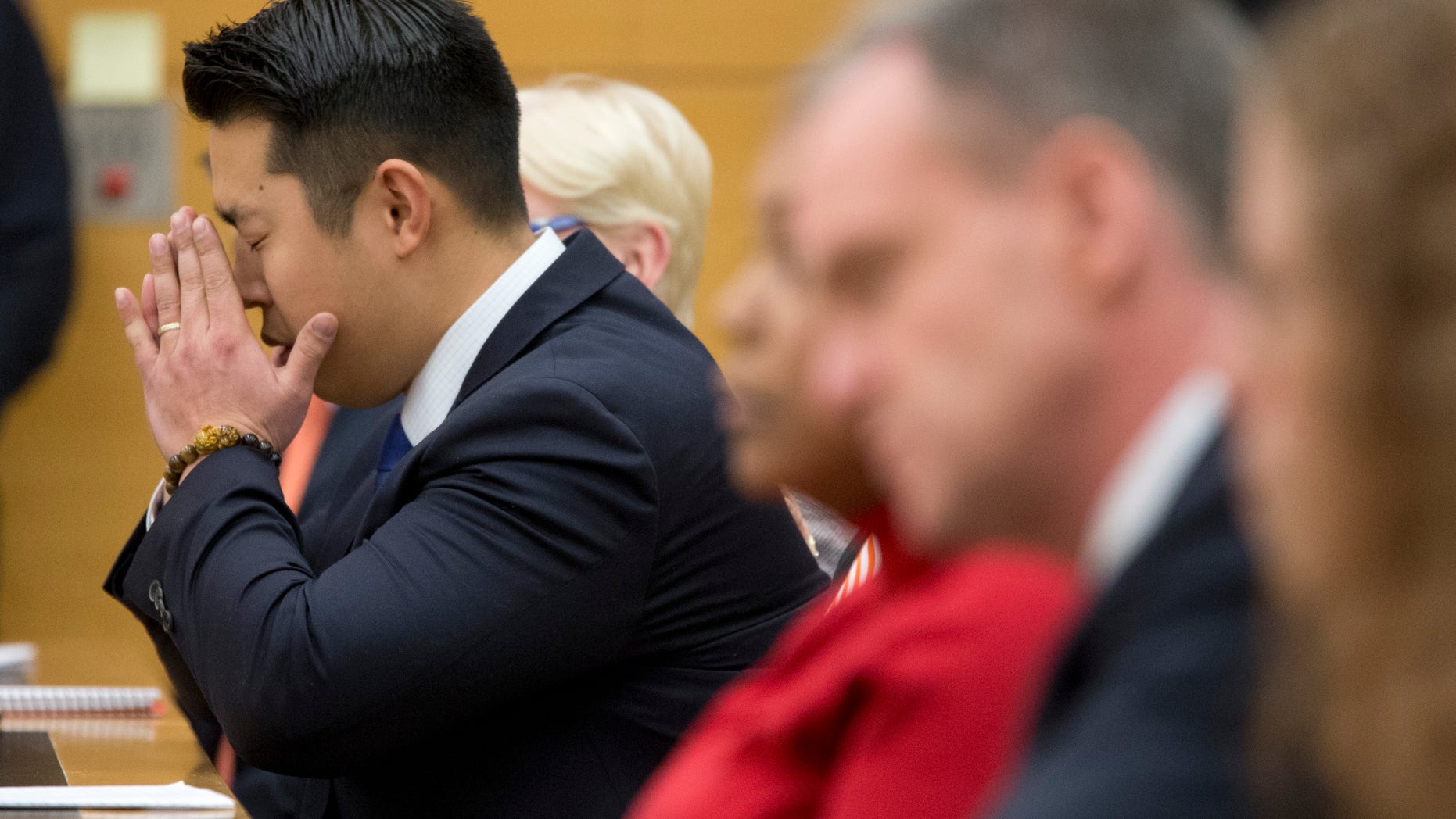 Police officer Peter Liang reacts as the verdict is read during his trial on charges in the shooting death of Akai Gurley, Thursday, Feb. 11, 2016 at Brooklyn Supreme court in New York in New York. (AP Photo/Mary Altaffer, Pool)
