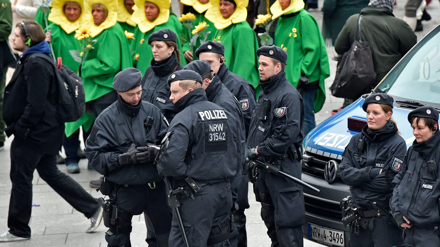 Police patrols in front of the main station during the start of the street carnival in Cologne, Germany on Thursday.