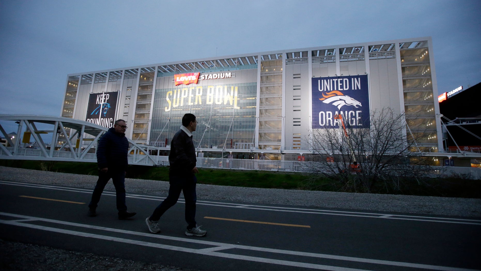 Visitors walk in front of Levi's Stadium Saturday.