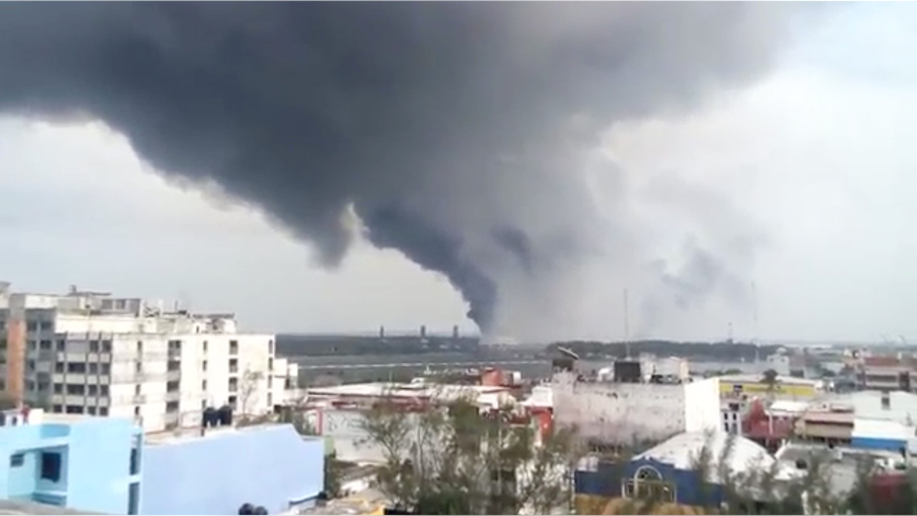 BEST QUALITY AVAILABLE - In this video grab a large plume of smoke rises from the Mexican State oil company Petroleos Mexicanos' petrochemical plant after an explosion in Coatzacoalcos, Mexico, Wednesday, April 20, 2016. The explosion killed several people, injuring dozens and sending flames and a toxin-filled cloud into the air, officials said. (Omar Diaz/Oaxaca Integro via AP)