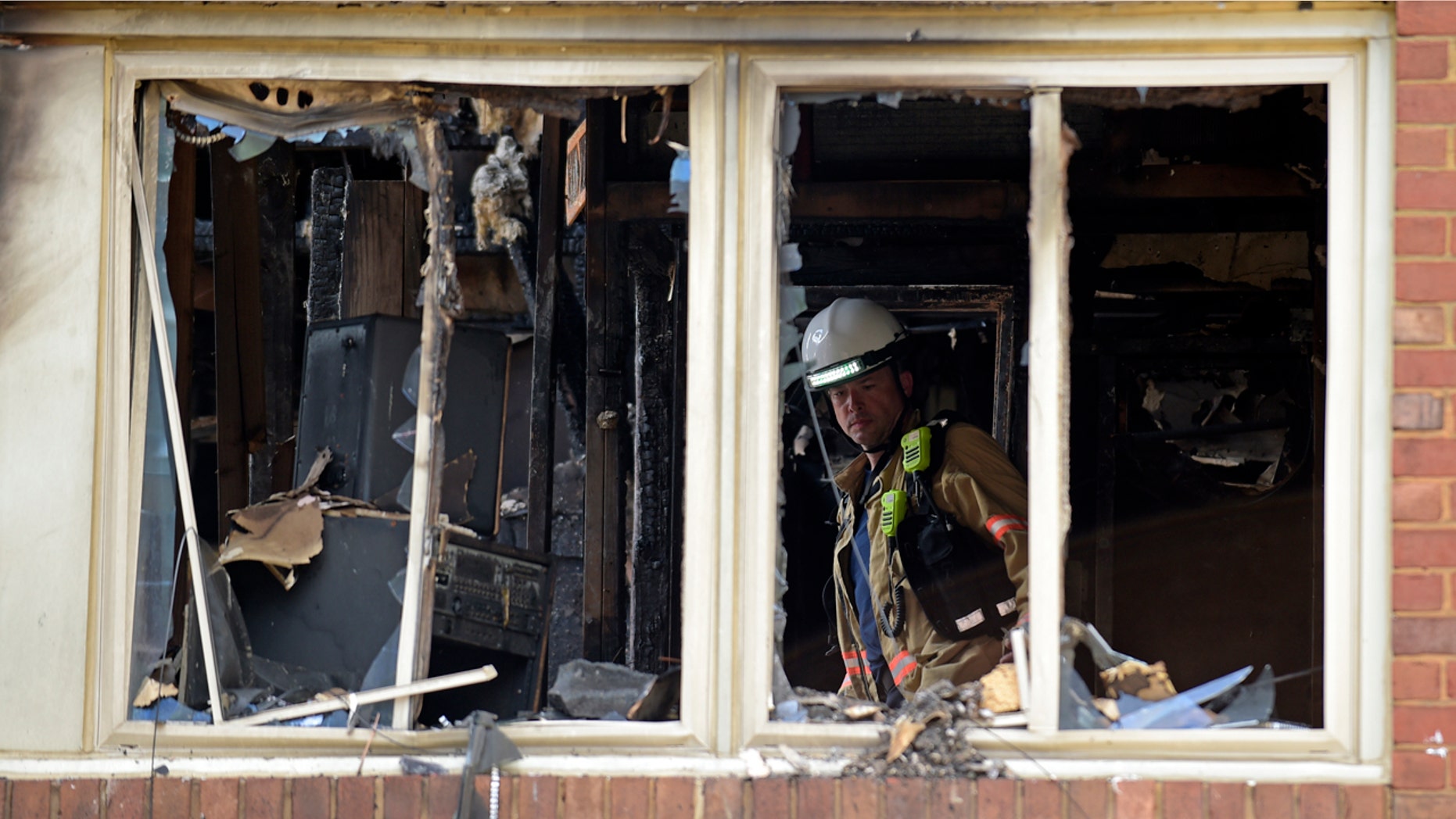 Aug. 11, 2016: Emergency personnel investigate the inside of an apartment building following a fire in Silver Spring, Md.