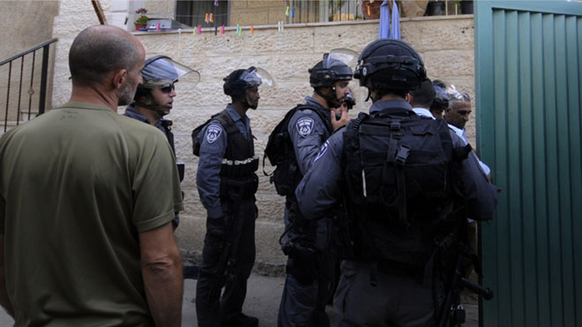 Sept. 30, 2014: Israeli police officers guard the house of Ziad Qarain, that Jewish settlers moved into, at the Palestinian neighborhood of Silwan, East Jerusalem