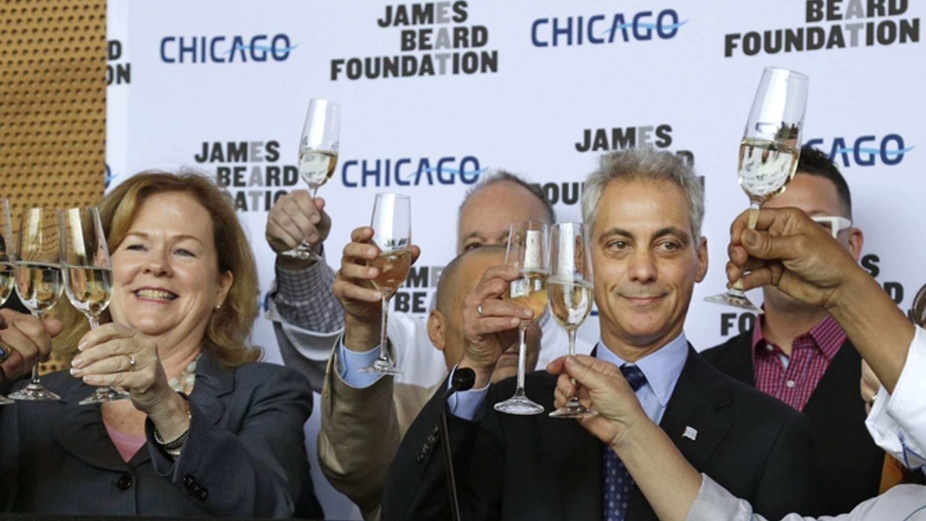 Susan Ungaro, President of the James Beard Foundation, left, and Chicago Mayor Rahm Emanuel, right, toast to the JBF Awards.